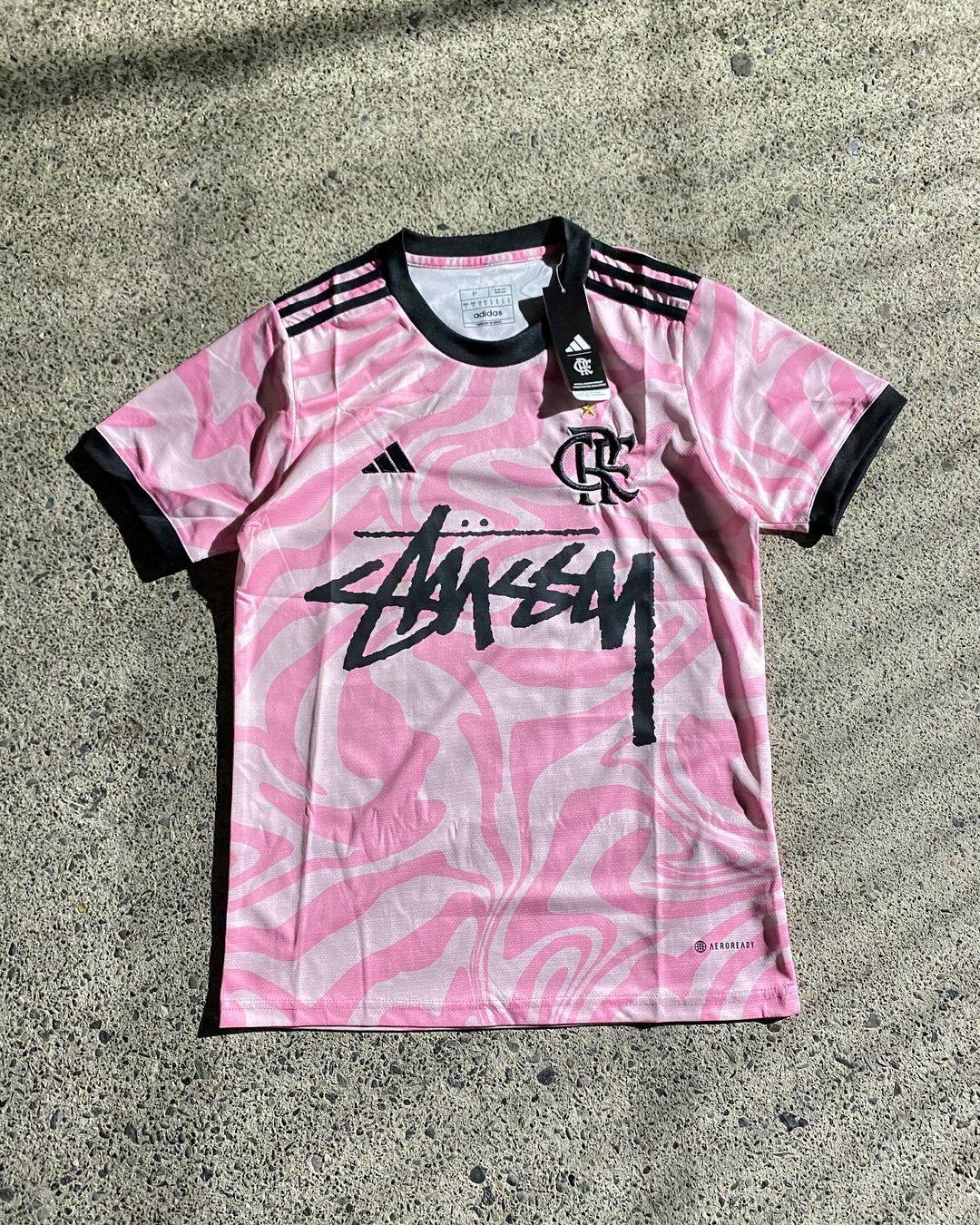 Stussy Flamengo Edition Jersey featuring Flamengo’s iconic red and black colors, combined with Stussy’s streetwear branding for a unique, limited-edition design.