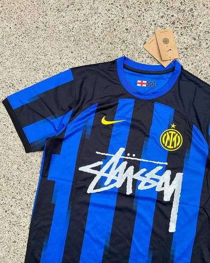 Inter Milan x Stussy Limited Jersey featuring Inter’s iconic black-and-blue stripes combined with Stussy’s bold logo, in an exclusive, limited-edition design.