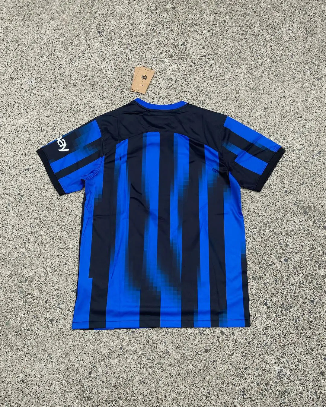 Inter Milan x Stussy Limited Jersey featuring Inter’s iconic black-and-blue stripes combined with Stussy’s bold logo, in an exclusive, limited-edition design.