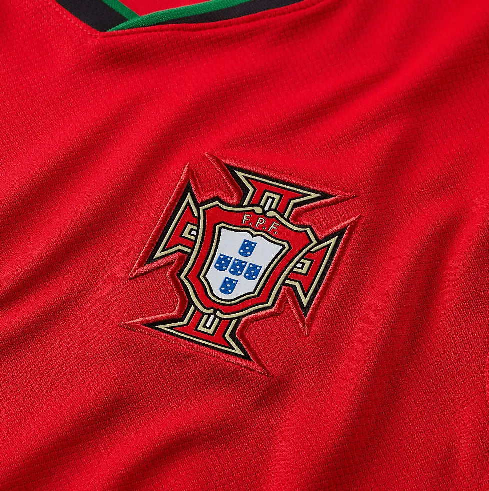 Stussy Portugal Edition Jersey featuring vibrant red and green colors, Stussy branding, and the Portugal national crest, celebrating the fusion of streetwear and football.